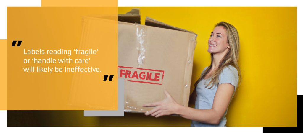 Woman holding box labelled fragile